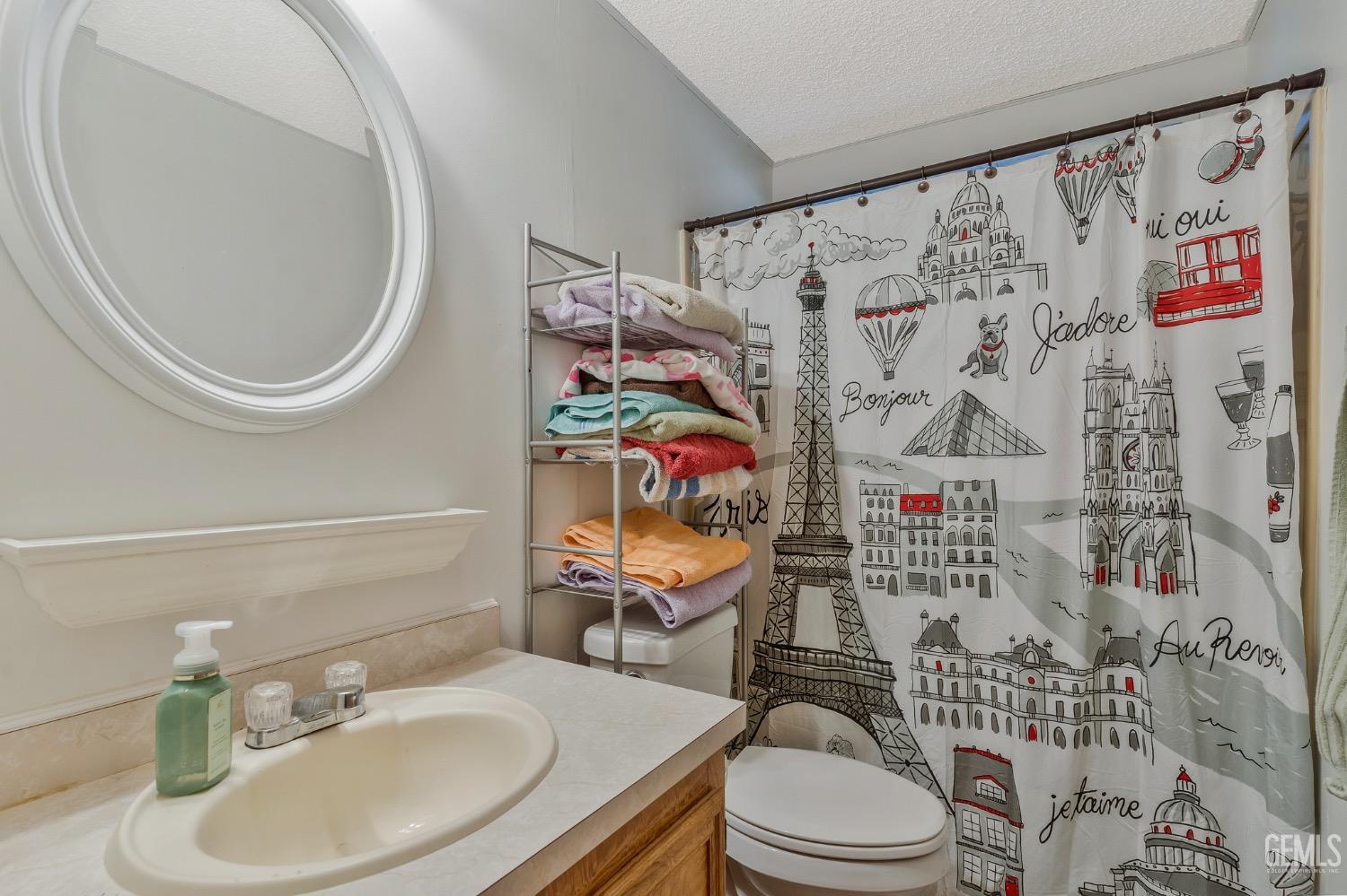 Undisclosed Address Bakersfield, CA 93306 - Photo 20 of 26 a bathroom with a toilet and a sink