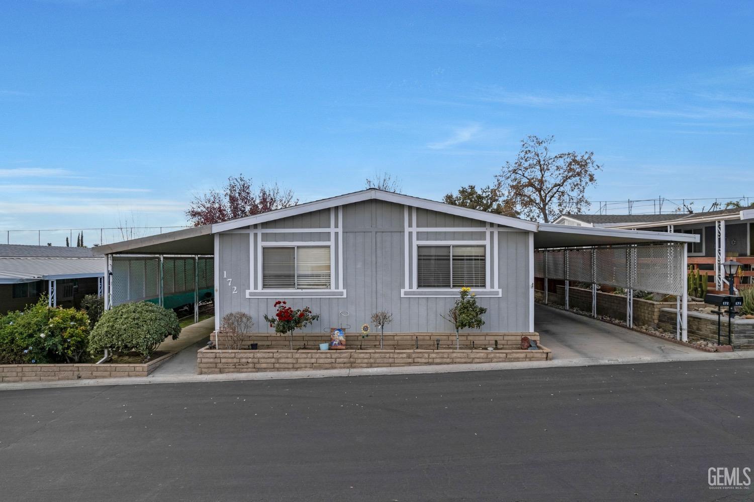 Undisclosed Address Bakersfield, CA 93306 - Photo 2 of 26 a front view of a house with a sitting area