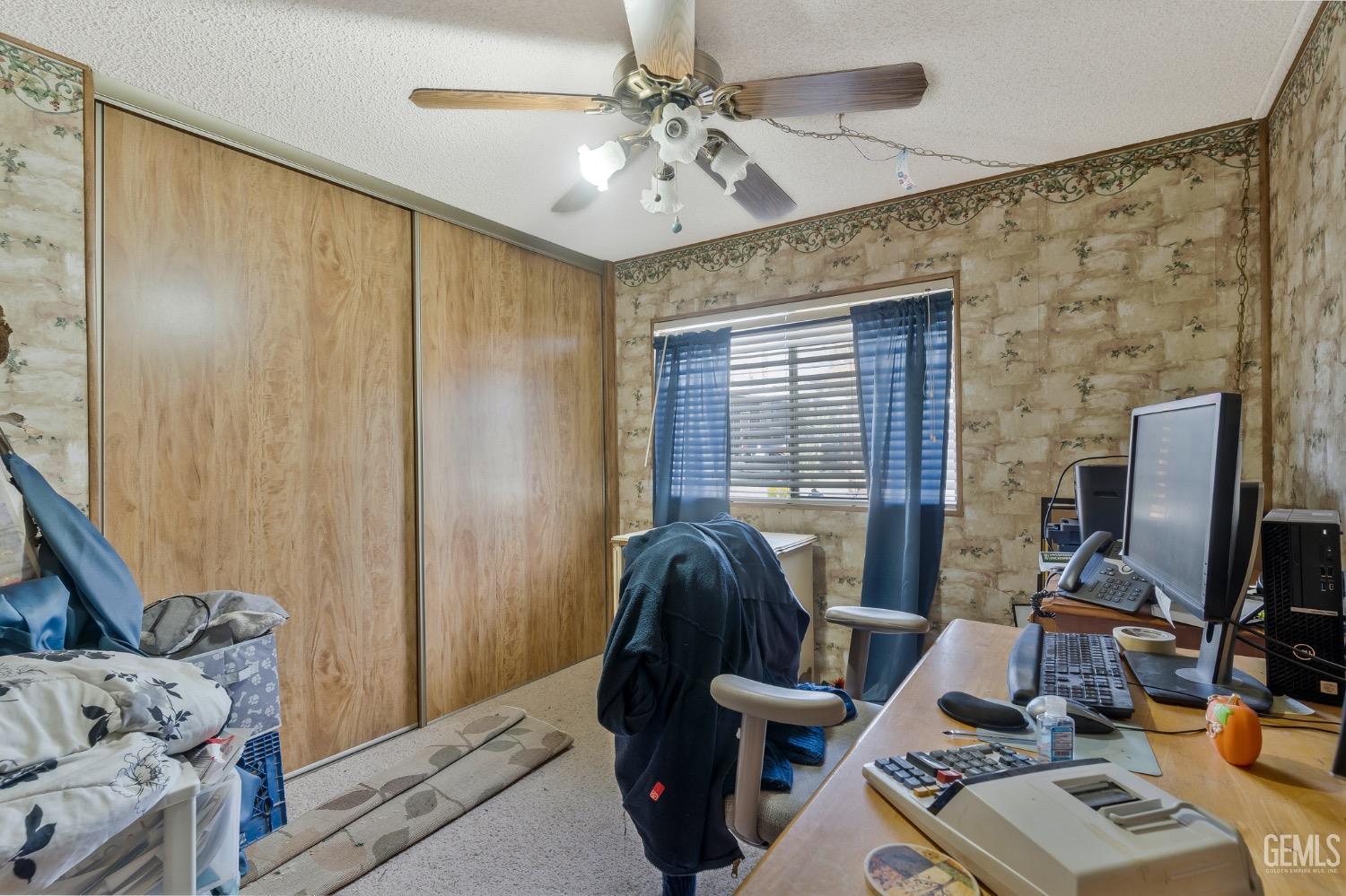 Undisclosed Address Bakersfield, CA 93306 - Photo 21 of 26 a living room with furniture and a flat screen tv