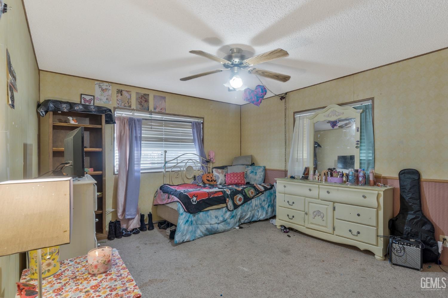 Undisclosed Address Bakersfield, CA 93306 - Photo 22 of 26 a living room with furniture and a window