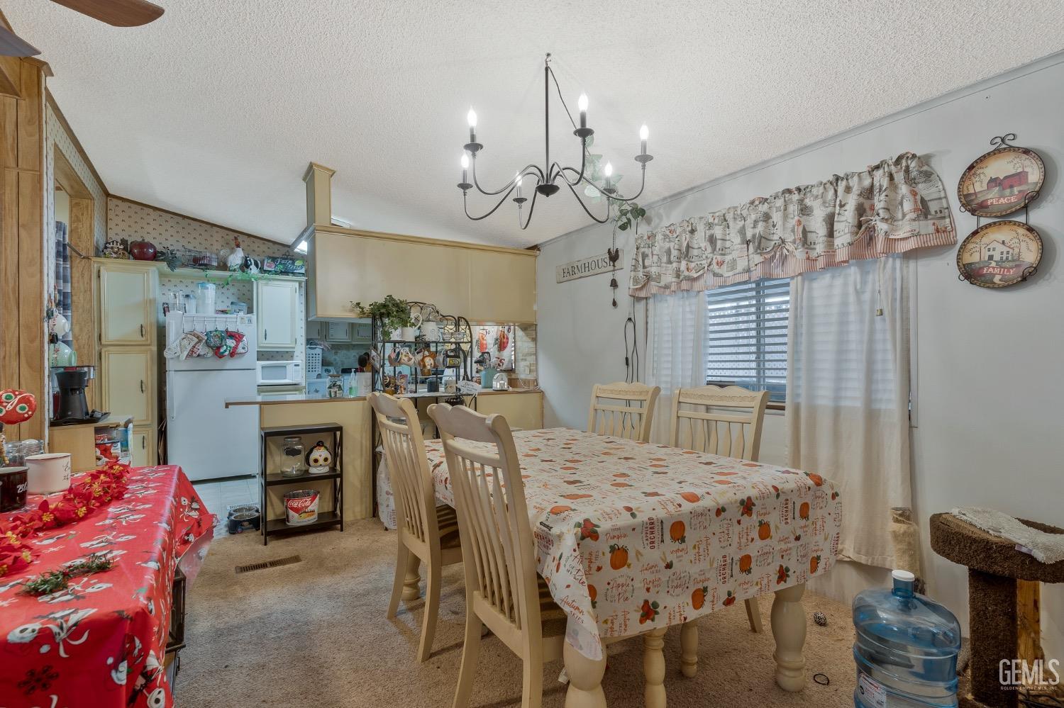 Undisclosed Address Bakersfield, CA 93306 - Photo 23 of 26 a view of a dining room with furniture and chandelier