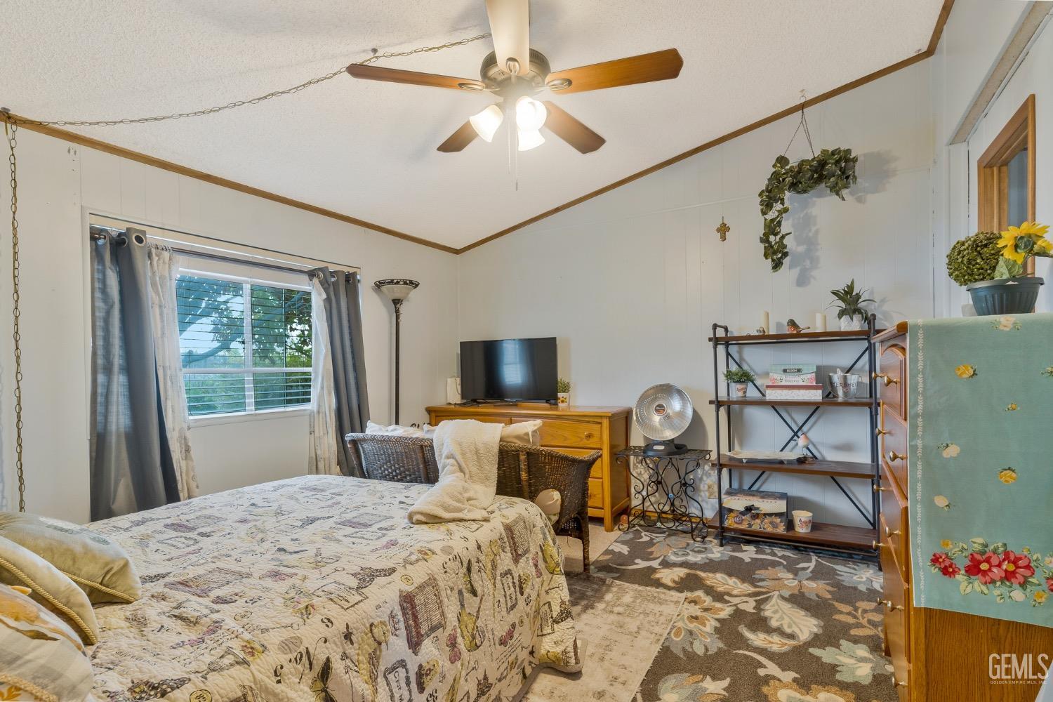 Undisclosed Address Bakersfield, CA 93306 - Photo 10 of 26 a bedroom with furniture and a window