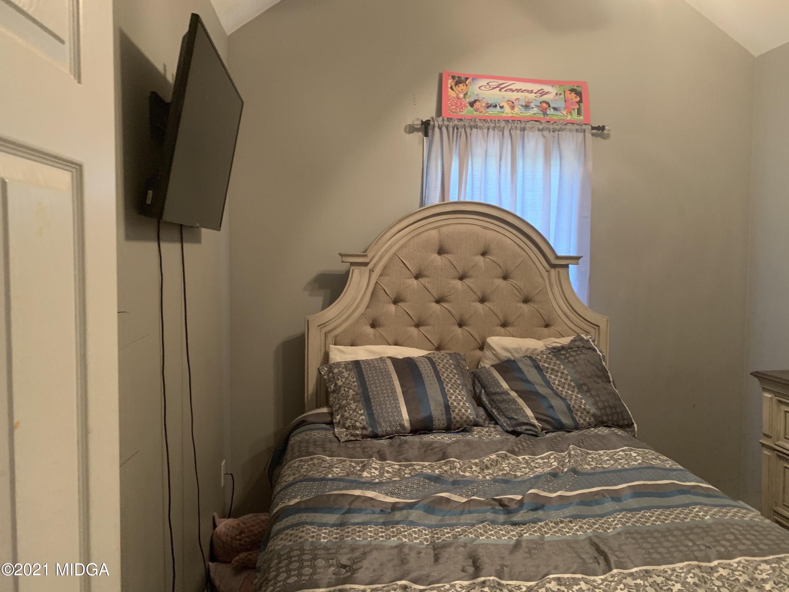 a view of a bedroom with a bed