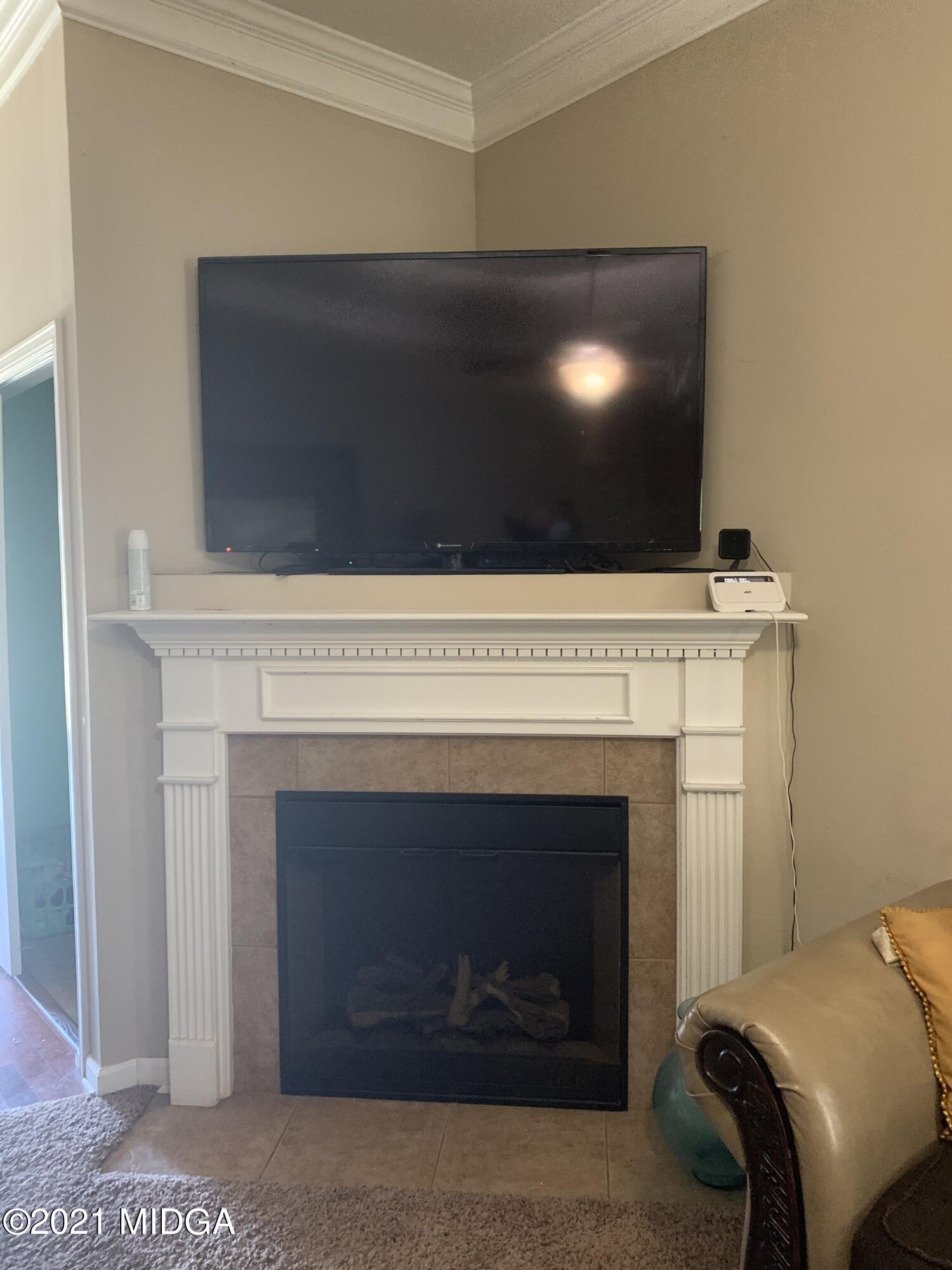 479 Bob White Road Macon, GA 31216 - Photo 2 of 9 a living room with a fireplace and a fireplace