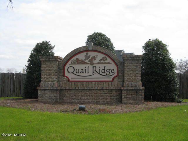 479 Bob White Road Macon, GA 31216 - Photo 4 of 9 a sign of golf club on a brick wall
