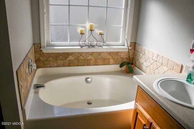 479 Bob White Road Macon, GA 31216 - Photo 6 of 9 a bathroom with a sink and a mirror