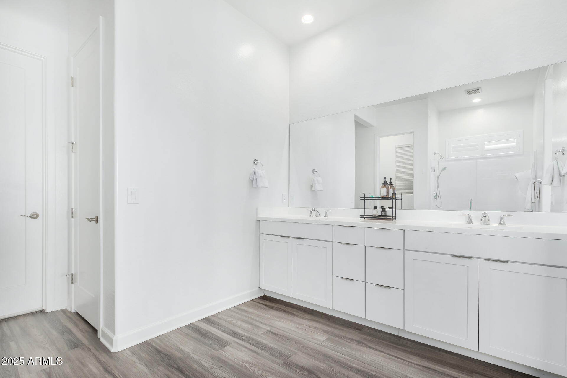 11048 East Utah Avenue Mesa, AZ 85212 - Photo 12 of 29 a bathroom with a double vanity sink and mirror
