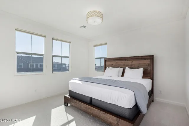 a bedroom with a bed and window