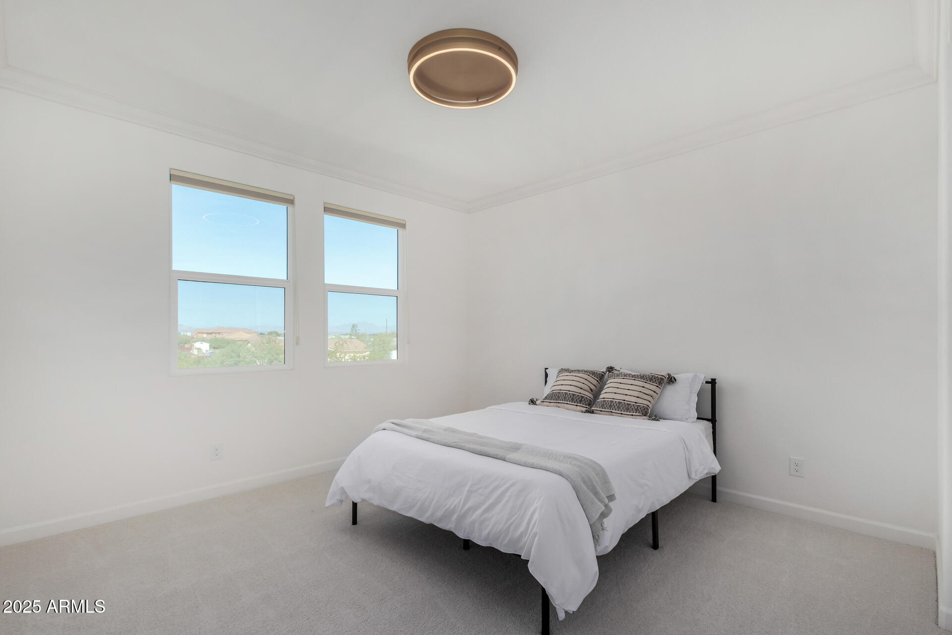11048 East Utah Avenue Mesa, AZ 85212 - Photo 18 of 29 a bedroom with a bed and window