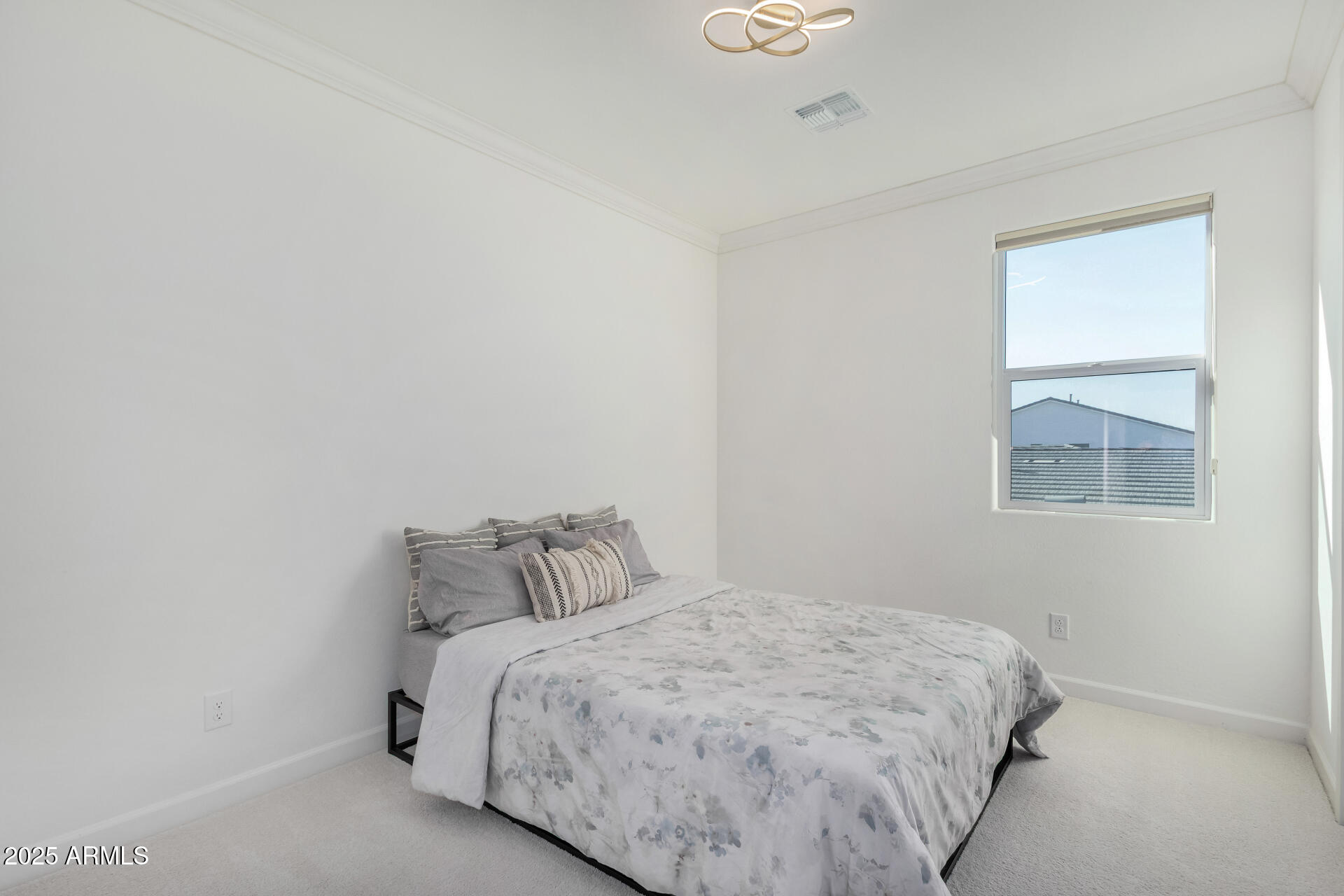 11048 East Utah Avenue Mesa, AZ 85212 - Photo 19 of 29 a bedroom with a bed and a window