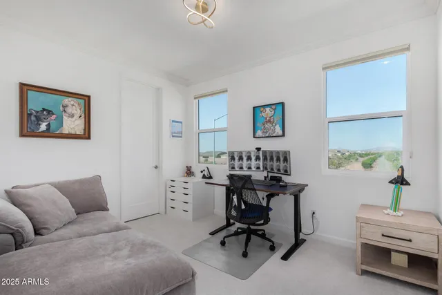 a view of a livingroom with workspace and a couch