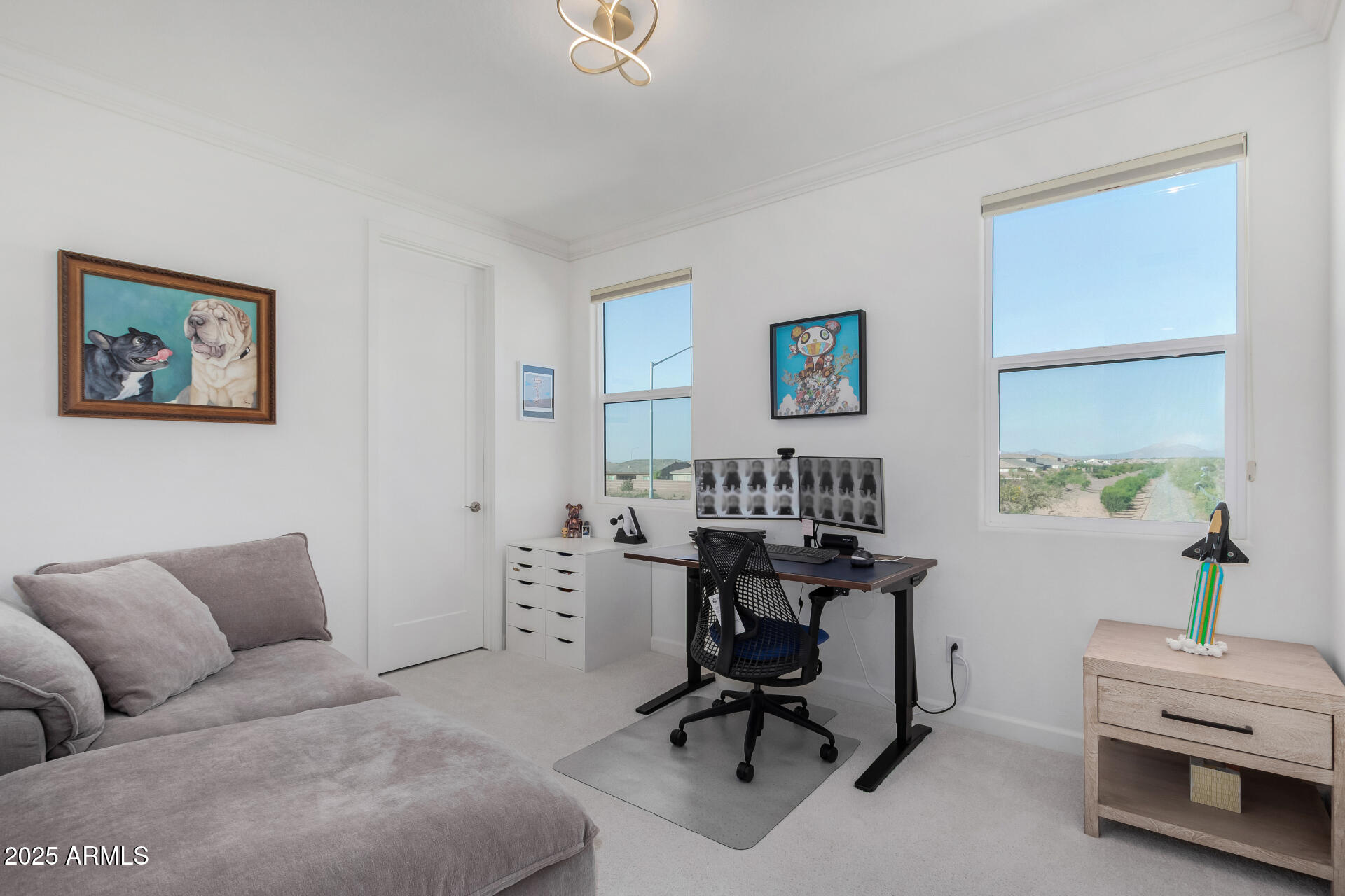 11048 East Utah Avenue Mesa, AZ 85212 - Photo 21 of 29 a view of a livingroom with workspace and a couch