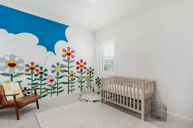 a bedroom with furniture and a window