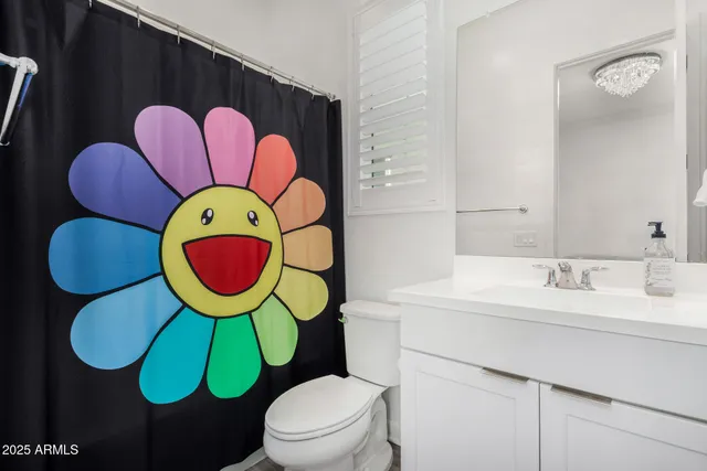a bathroom with a toilet and a sink