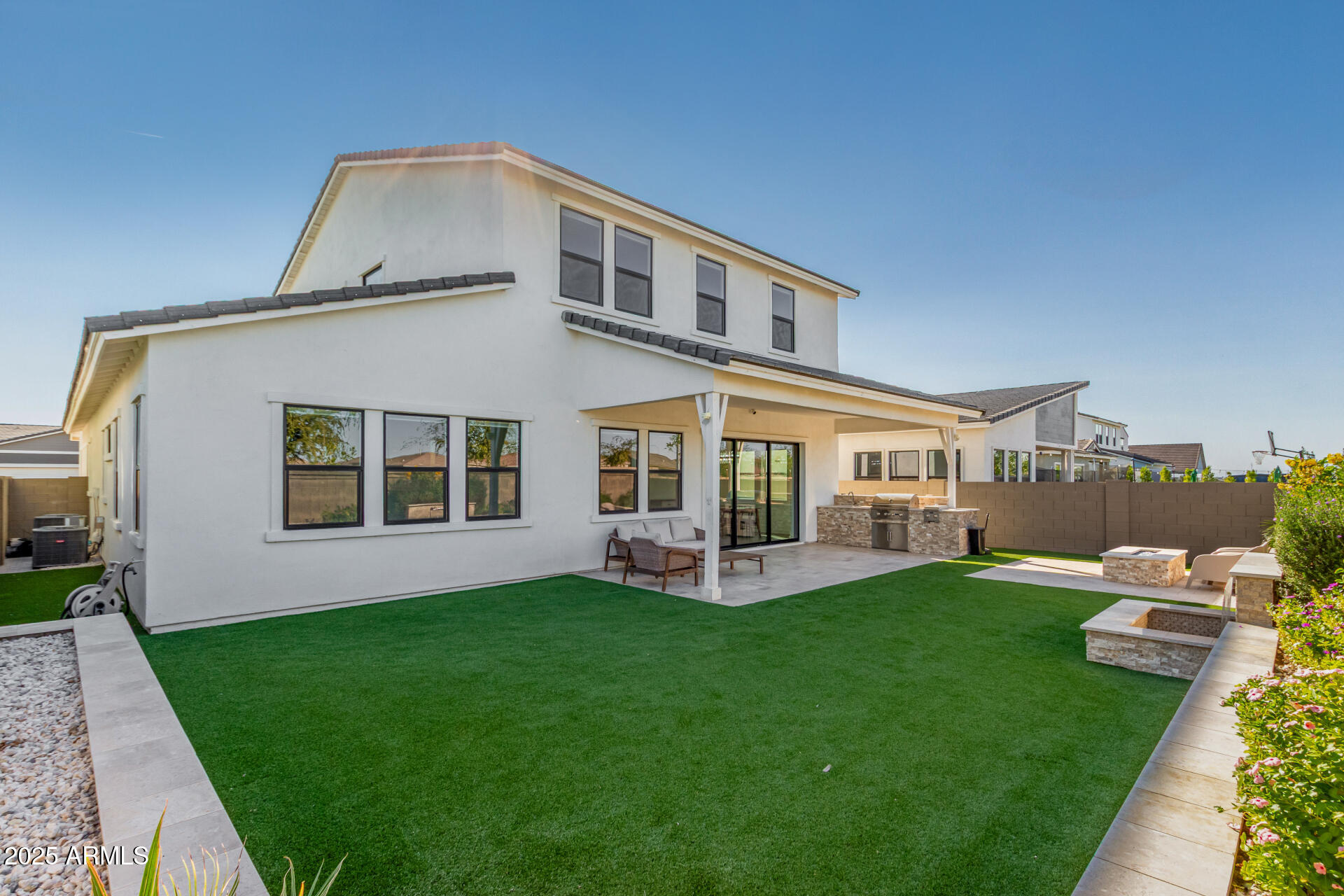 11048 East Utah Avenue Mesa, AZ 85212 - Photo 26 of 29 a front view of a house with a yard table and chairs