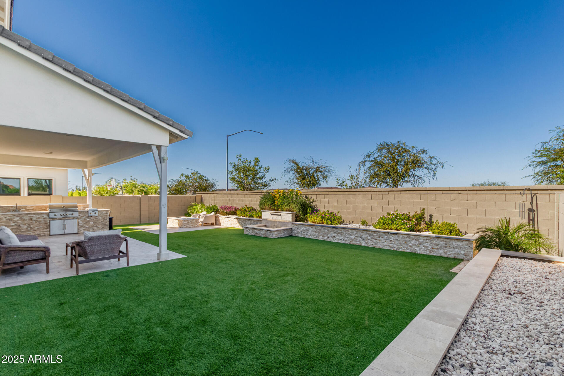 11048 East Utah Avenue Mesa, AZ 85212 - Photo 27 of 29 a view of a garden with an outdoor seating