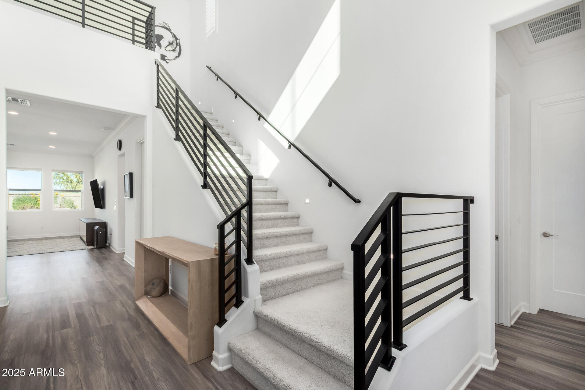 11048 East Utah Avenue Mesa, AZ 85212 - Photo 3 of 29 a view of entryway and hall with wooden floor