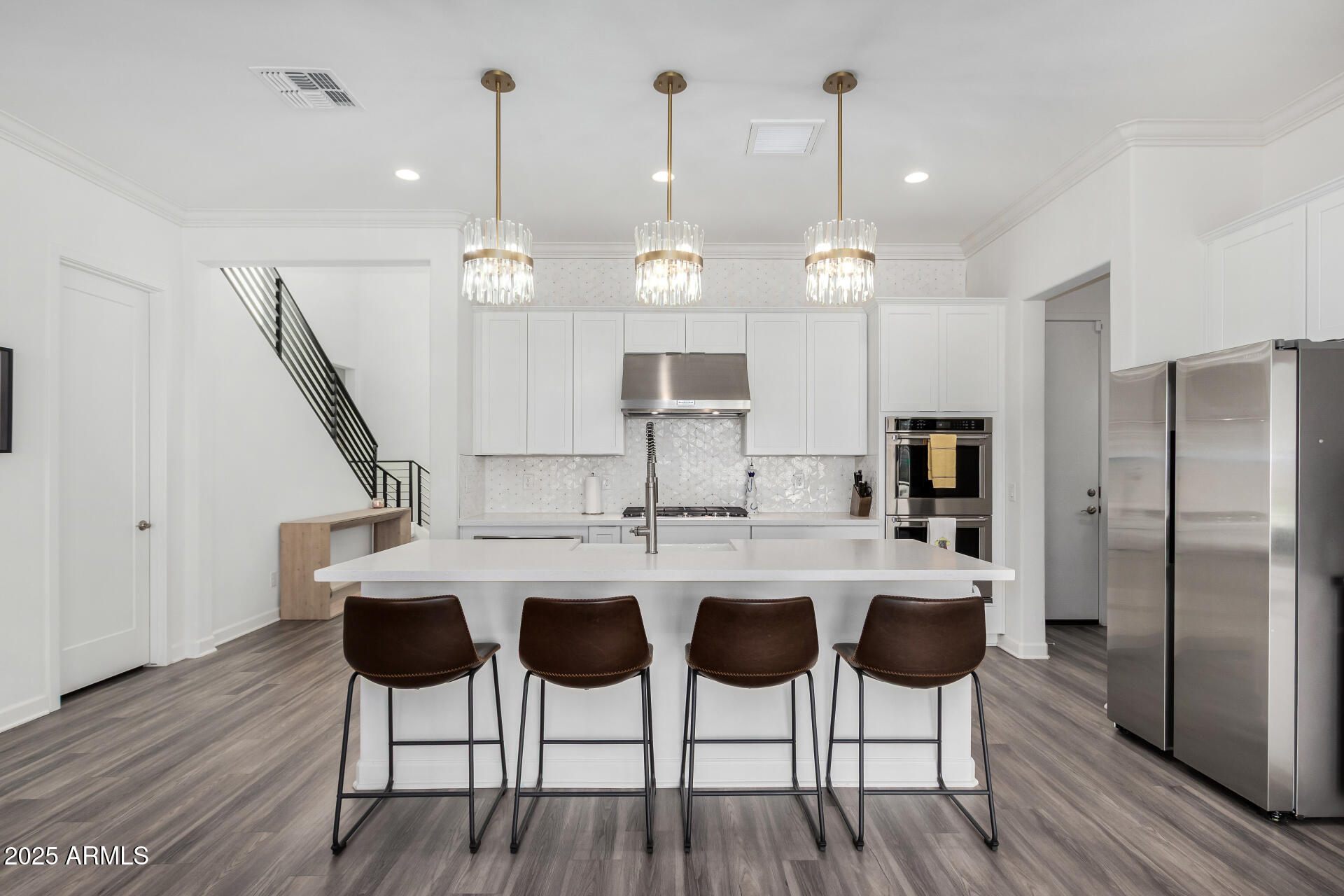 11048 East Utah Avenue Mesa, AZ 85212 - Photo 7 of 29 a kitchen with a dining table chairs and wooden floor