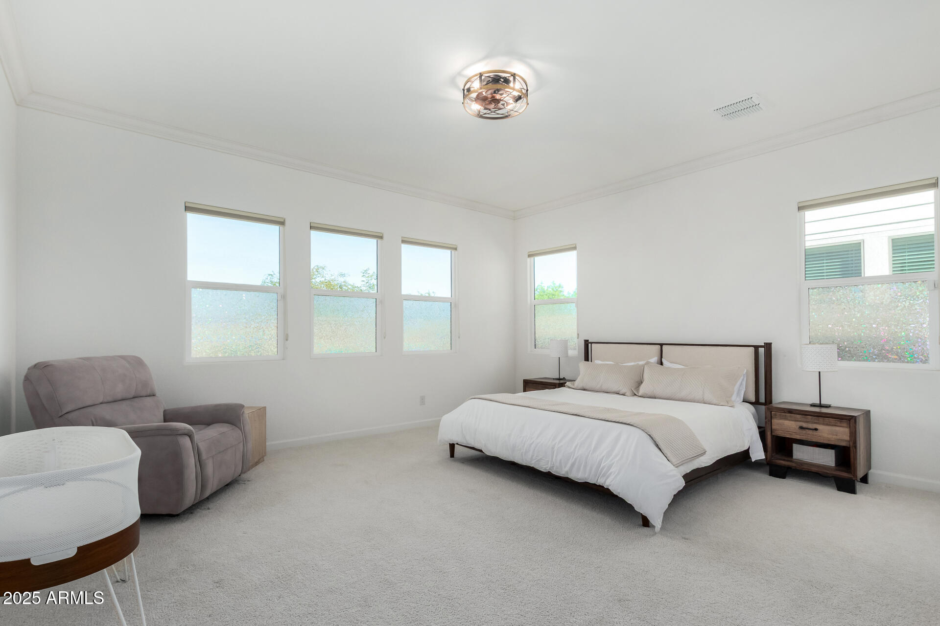 11048 East Utah Avenue Mesa, AZ 85212 - Photo 10 of 29 a bedroom with a bed couch and a window