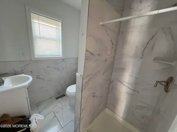 a bathroom with a toilet and a sink