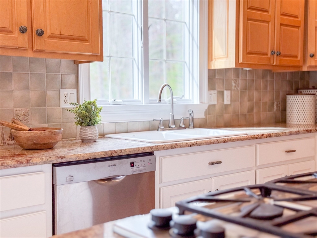 60 Golden Run Road Bolton, MA 01740 - Photo 11 of 42 a bathroom with a granite countertop sink and a mirror