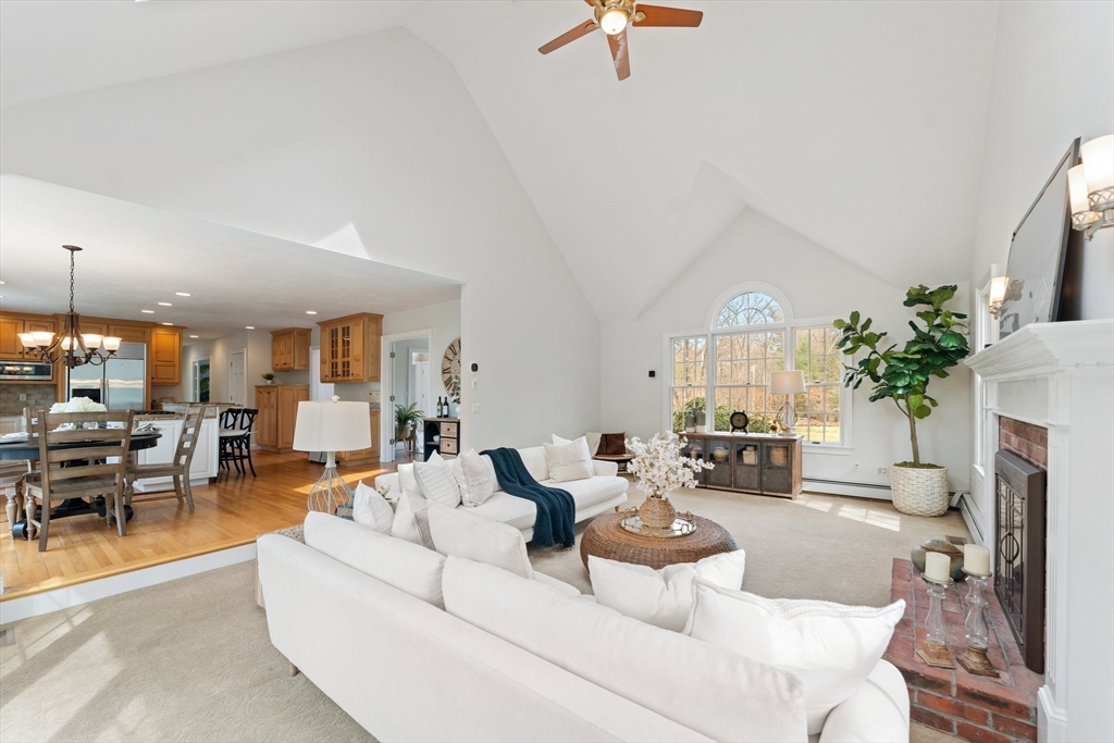 60 Golden Run Road Bolton, MA 01740 - Photo 12 of 42 a living room with furniture and a fireplace