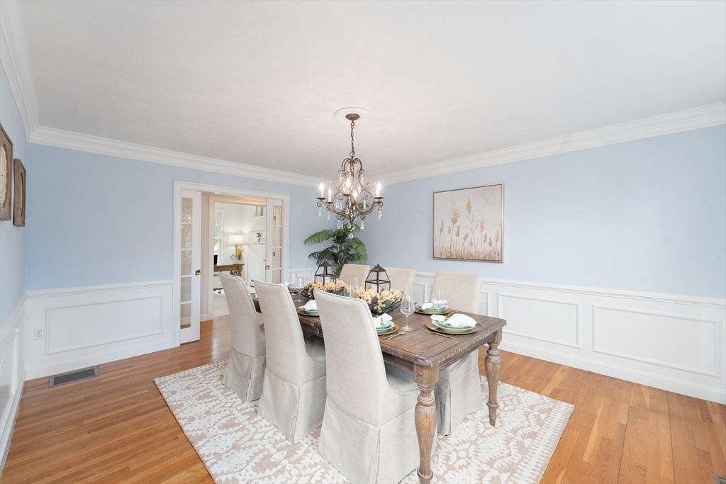 60 Golden Run Road Bolton, MA 01740 - Photo 16 of 42 a view of a dining room with furniture and wooden floor