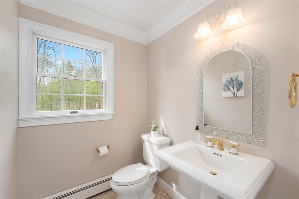 60 Golden Run Road Bolton, MA 01740 - Photo 18 of 42 a bathroom with a toilet a sink and mirror