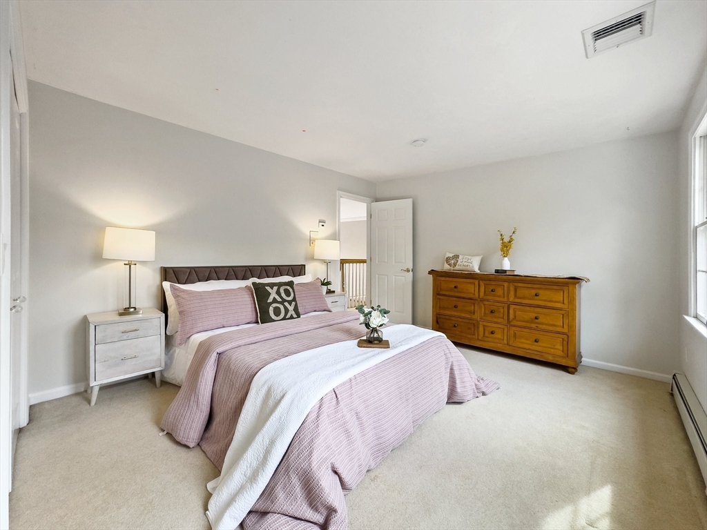 60 Golden Run Road Bolton, MA 01740 - Photo 19 of 42 a spacious bedroom with a bed and a night stand
