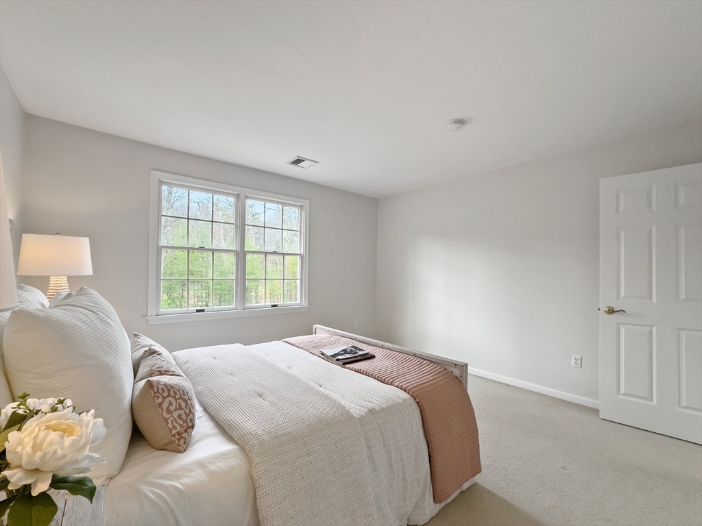 60 Golden Run Road Bolton, MA 01740 - Photo 20 of 42 a bedroom with a bed and a window