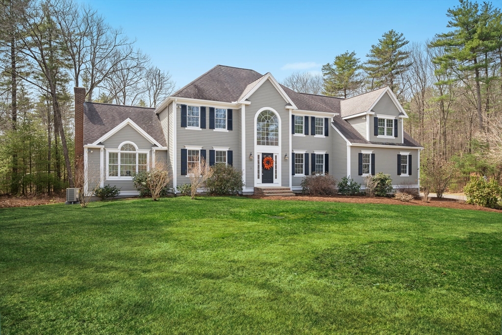 60 Golden Run Road Bolton, MA 01740 - Photo 2 of 42 a front view of a house with a garden