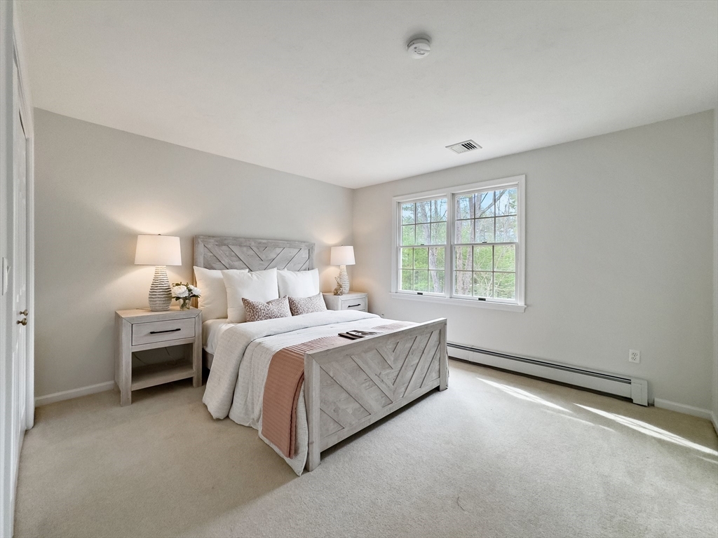 60 Golden Run Road Bolton, MA 01740 - Photo 21 of 42 a bed room with a bed and a window