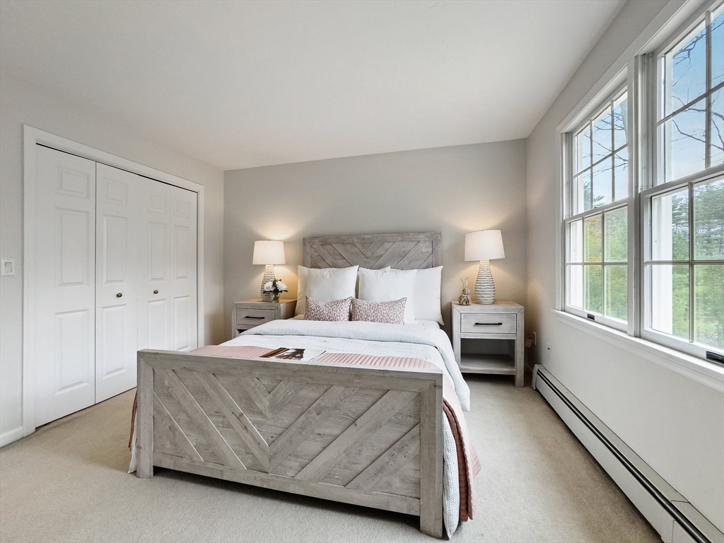 60 Golden Run Road Bolton, MA 01740 - Photo 22 of 42 a bedroom with a bed and a large window