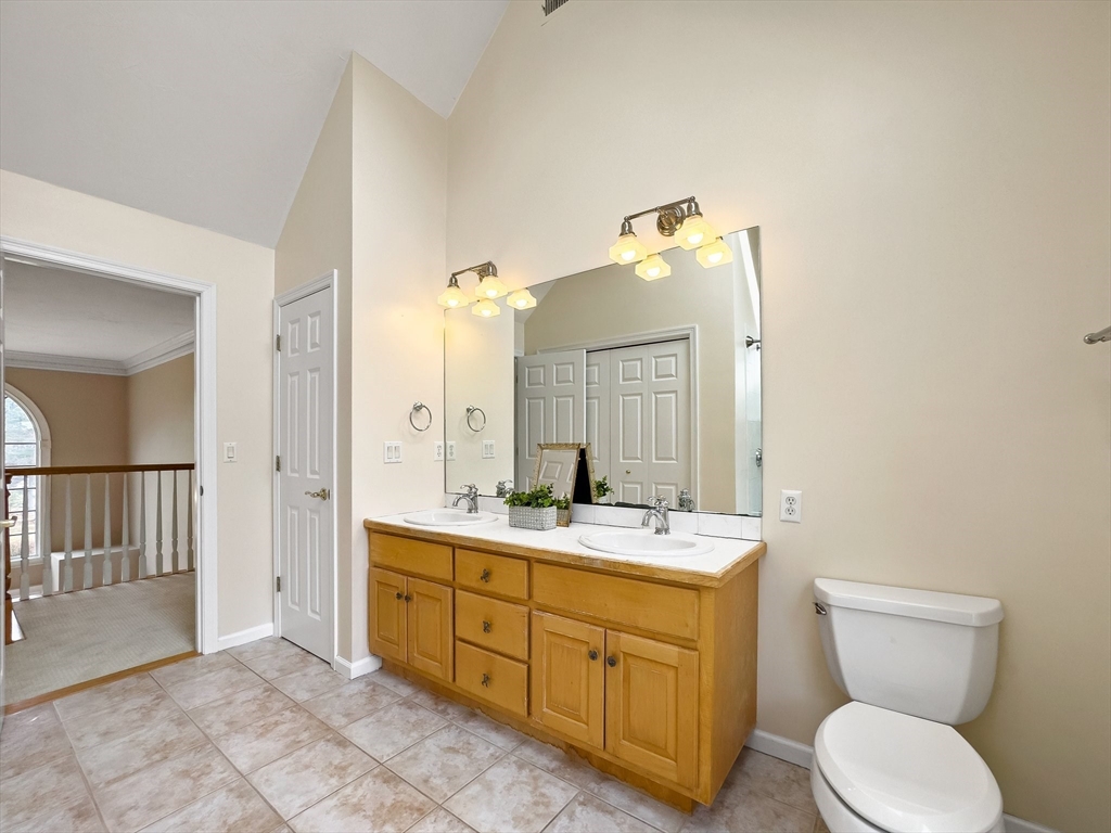 60 Golden Run Road Bolton, MA 01740 - Photo 27 of 42 a spacious bathroom with a toilet sink and mirror