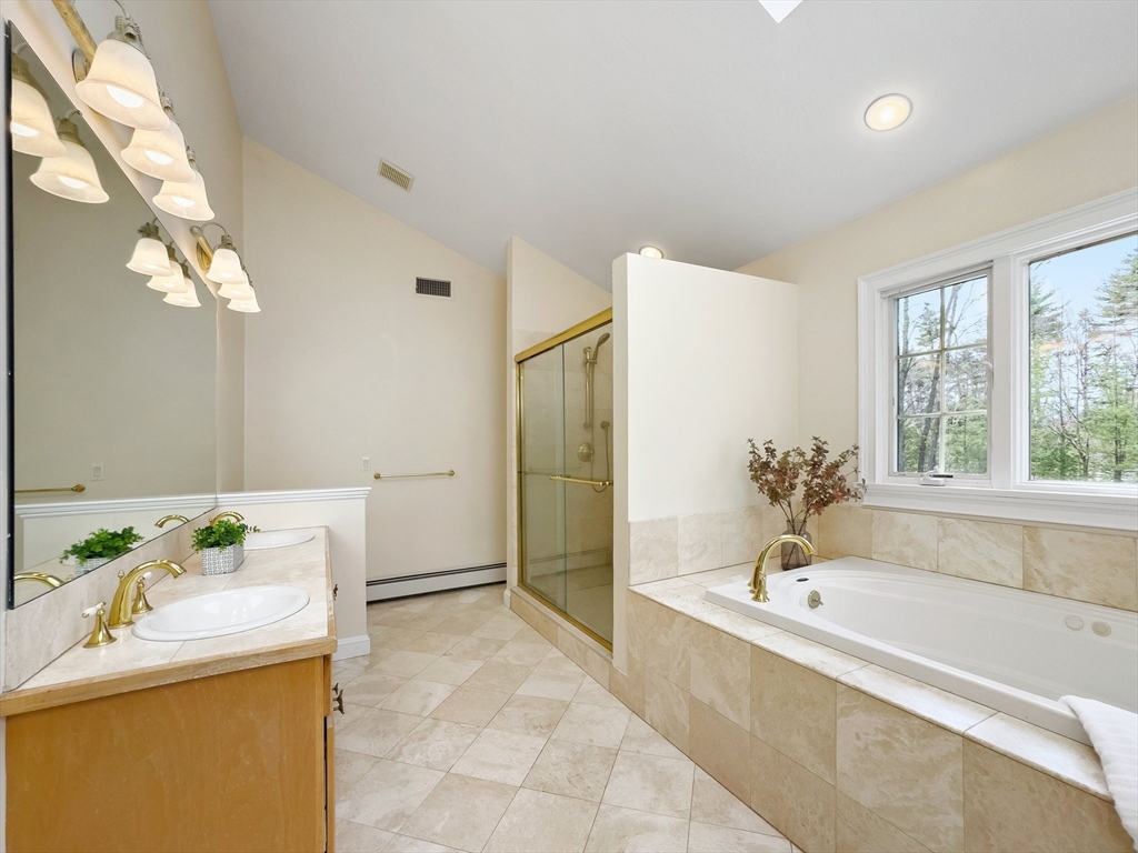 60 Golden Run Road Bolton, MA 01740 - Photo 30 of 42 a bathroom with a tub sink and mirror