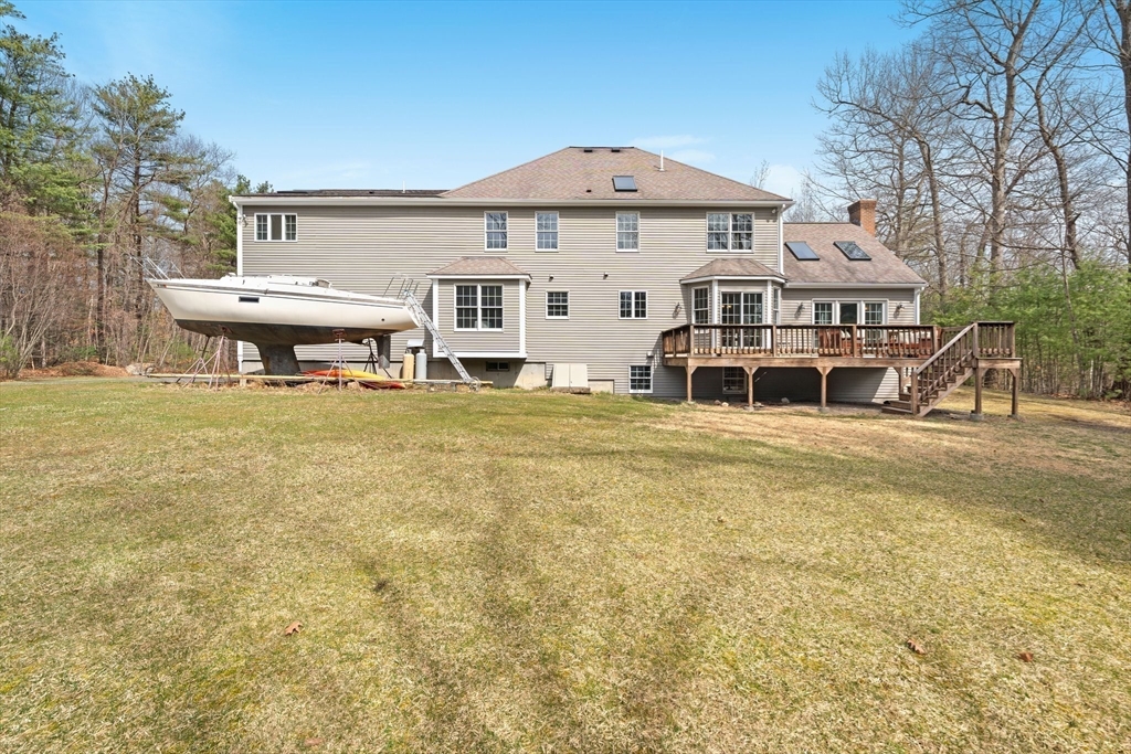 60 Golden Run Road Bolton, MA 01740 - Photo 37 of 42 a view of a house with pool and chairs