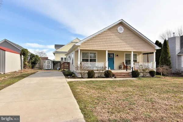 a view of a house with sitting area and view of a house