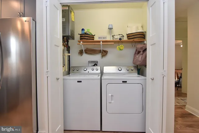 a view of storage and utility room with washer and dryer