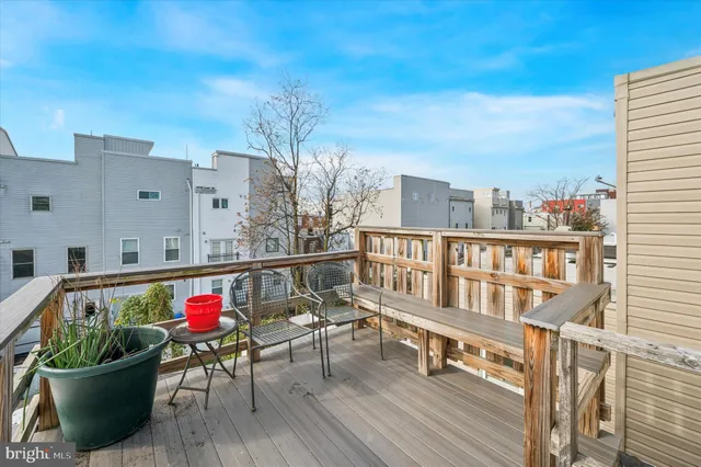 a view of a balcony with furniture