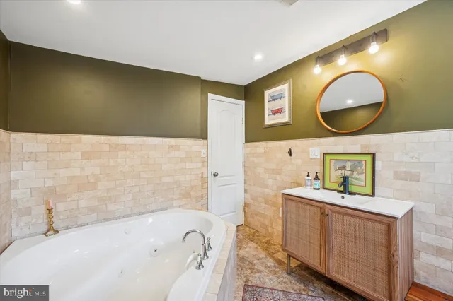 a bathroom with a bathtub and a sink