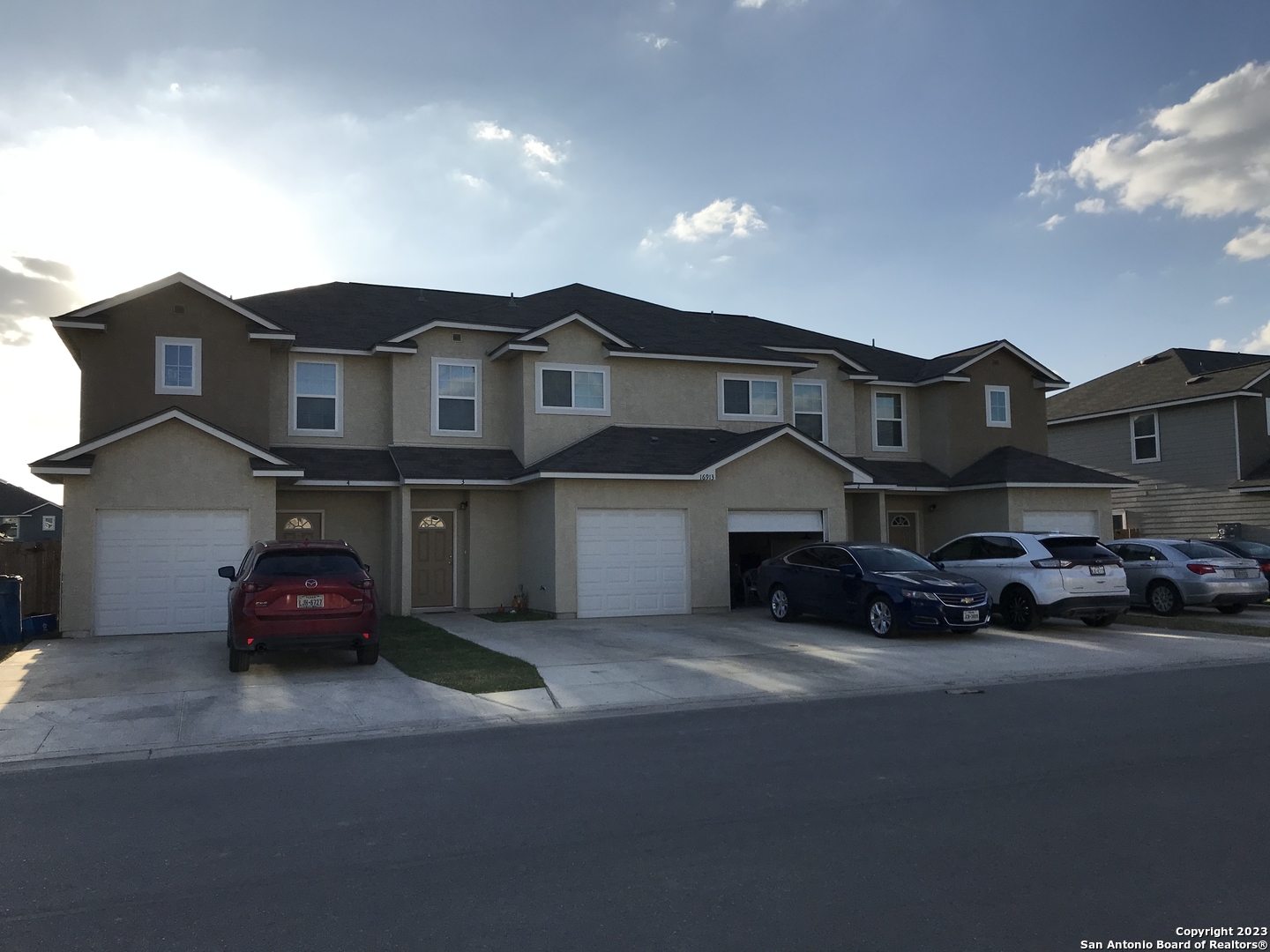 a car parked in front of a house