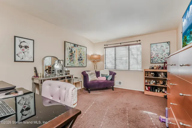 a bedroom with furniture and a window