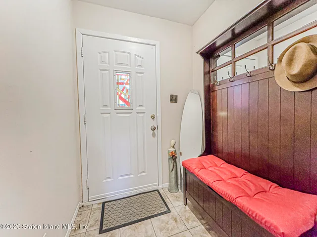 a bedroom with a bed and a mirror