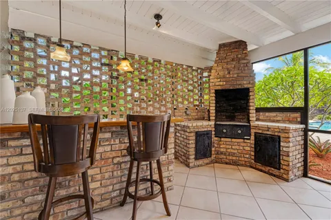 a view of a dining room with furniture and window