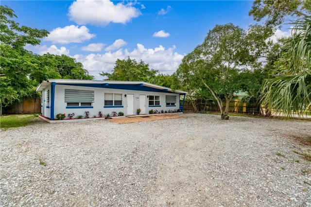 front view of a house with a garden