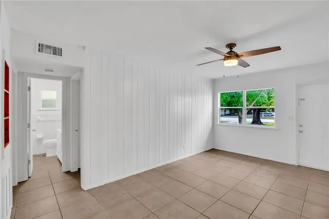 a view of an empty room with a window