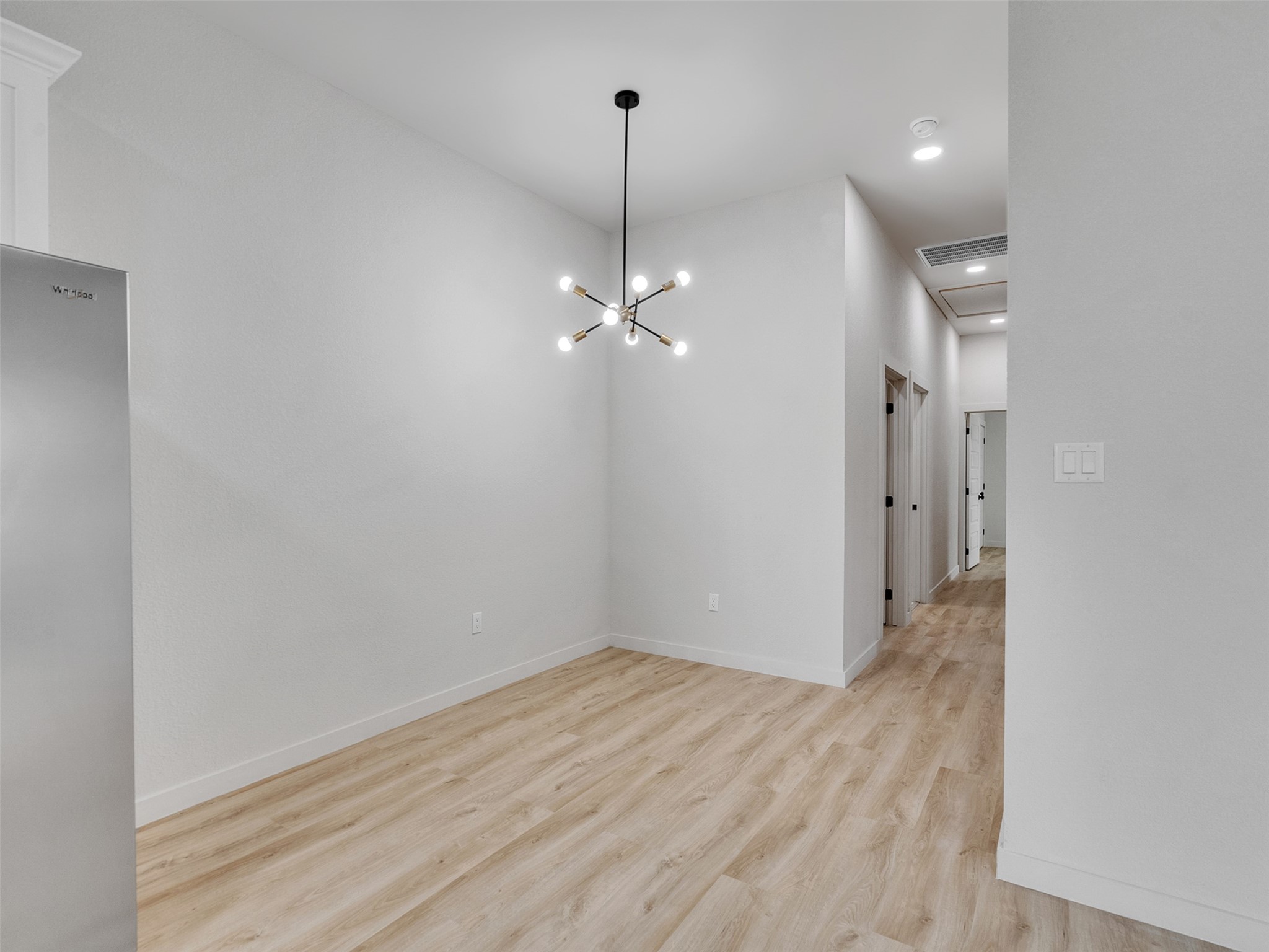 9707 Cargill Street, Unit AB Houston, TX 77029 - Photo 17 of 32 a view of a room with wooden floor and ceiling fan