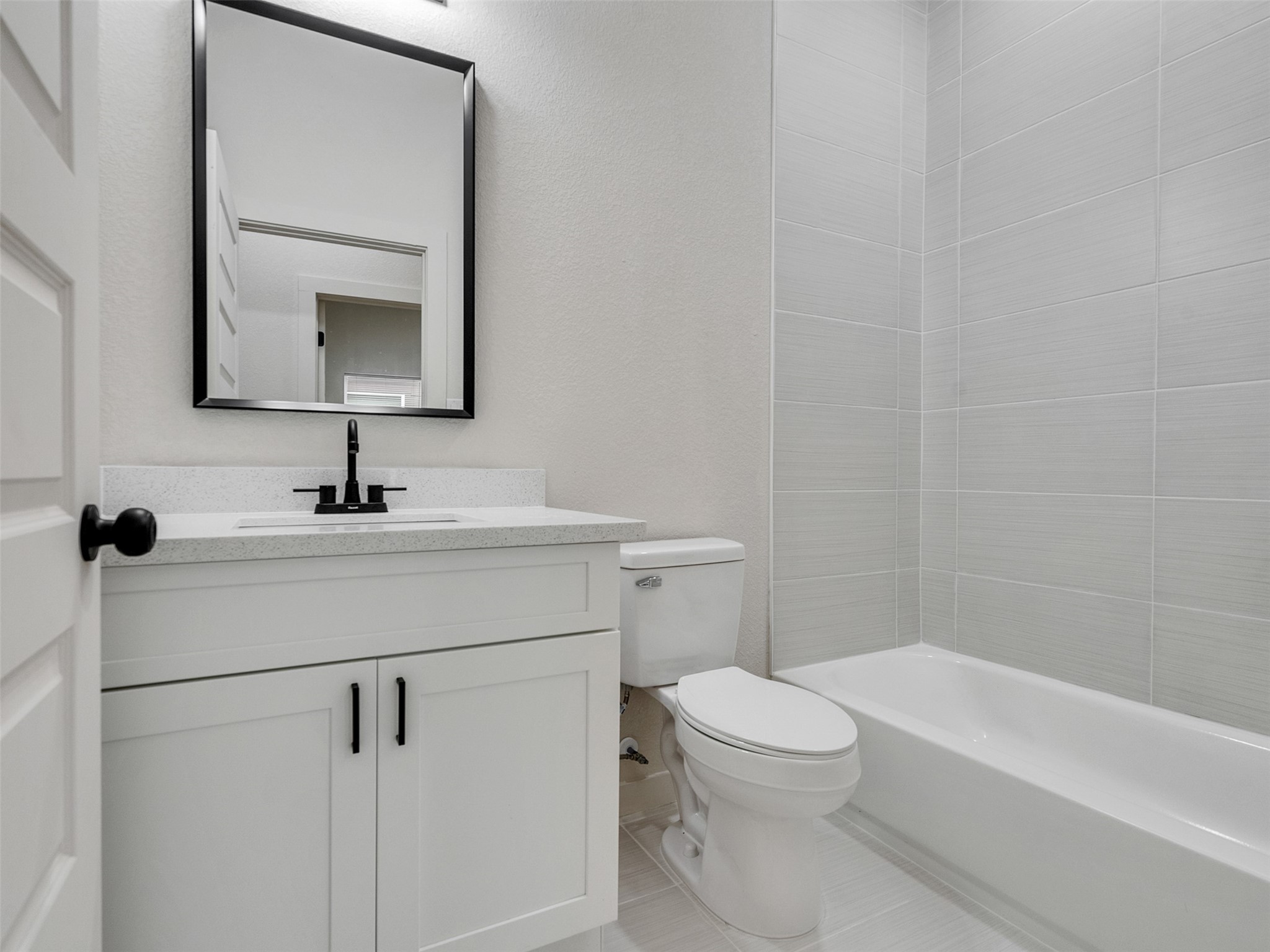9707 Cargill Street, Unit AB Houston, TX 77029 - Photo 22 of 32 a bathroom with a sink a toilet and a mirror