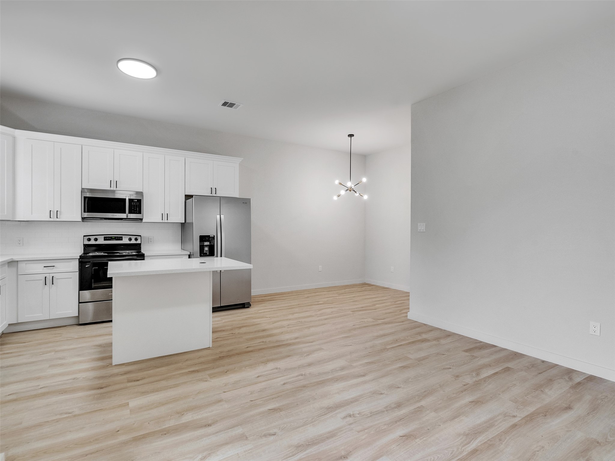 9707 Cargill Street, Unit AB Houston, TX 77029 - Photo 8 of 32 a view of kitchen with microwave and cabinets