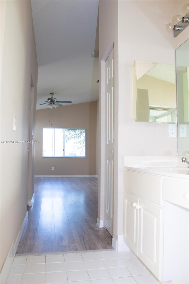 13221 Southwest 53rd Street Miramar, FL 33027 - Photo 20 of 32 a view of empty room with wooden floor